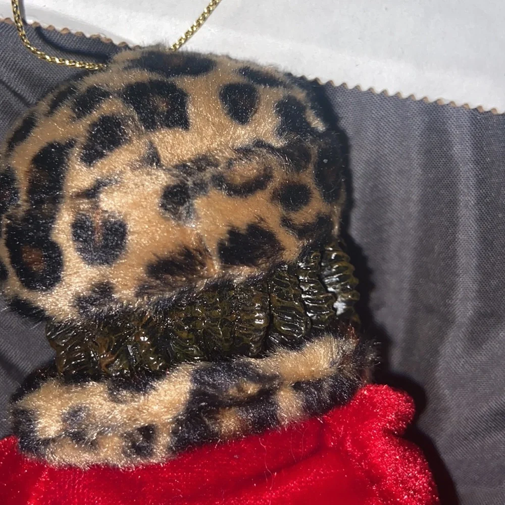Vintage African American doll ornament with red velvet and leopard fur purse